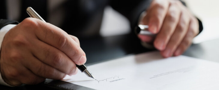 Businessman Signing Contract In The Office