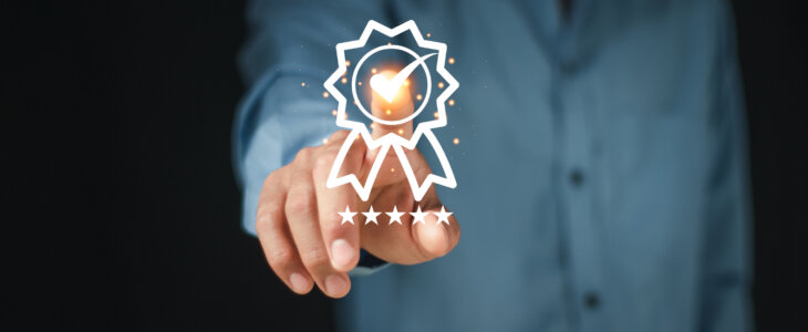 Businessman Hand touching on the sign of the top service the best Quality assurance, Guarantee, Standards, ISO certification and standardization concept. guarantee product and ISO service concept.