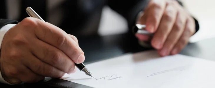 Businessman Signing Contract In The Office